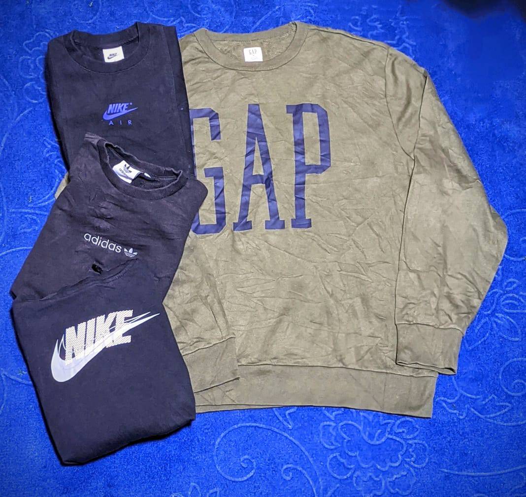 Pulls Nike Premium et autres marques comme Adidas, Puma, Polo, Kangol, Gap, The North Face.