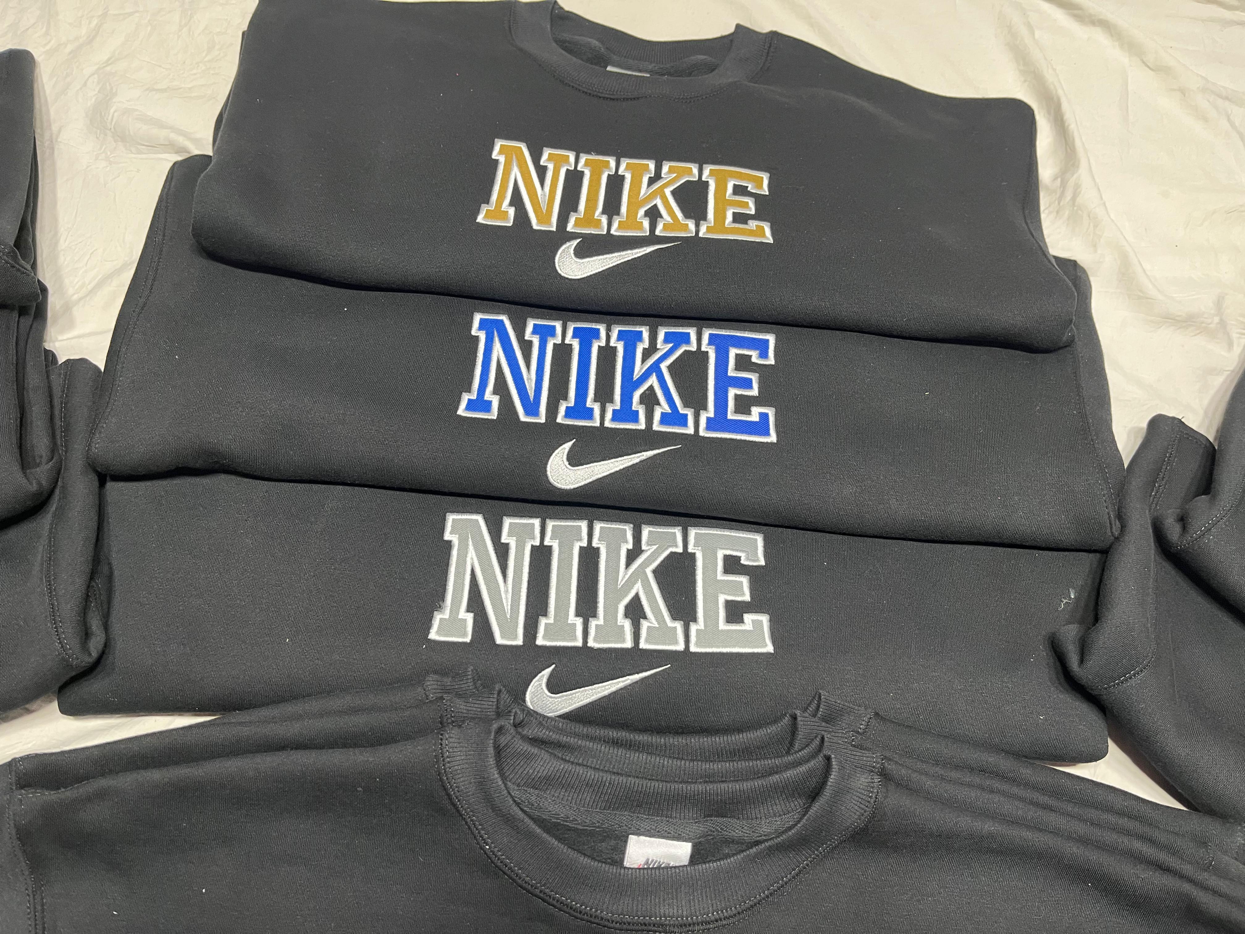 リワークスタイルのNikeブラックスウェットシャツ。