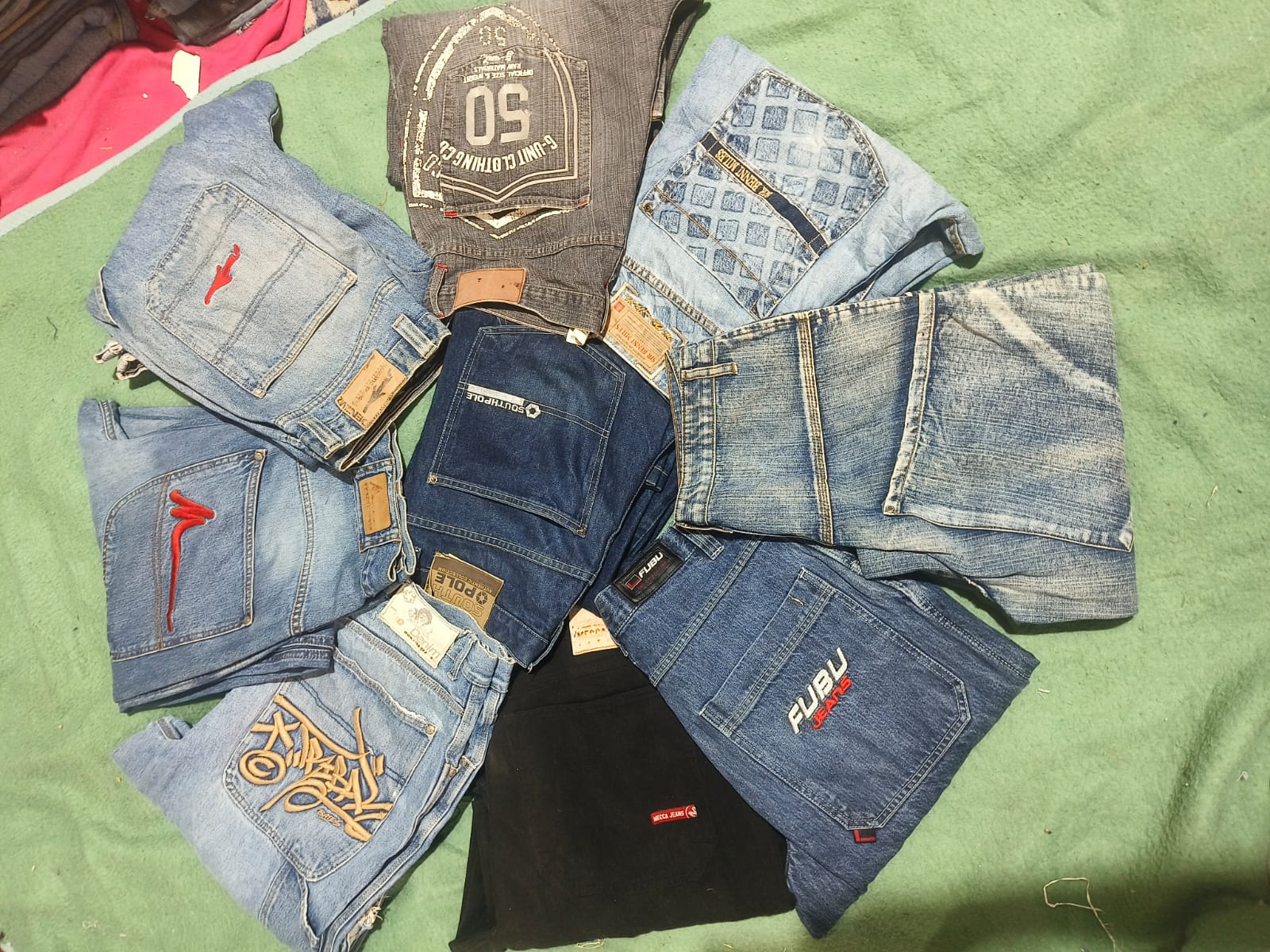 Branded and unbranded hip hop baggy jeans