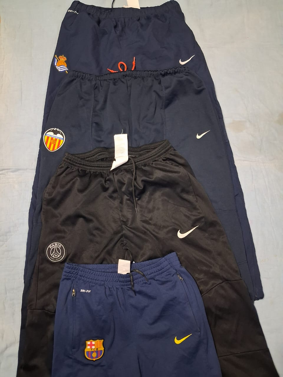 Nike and Adidas track pants