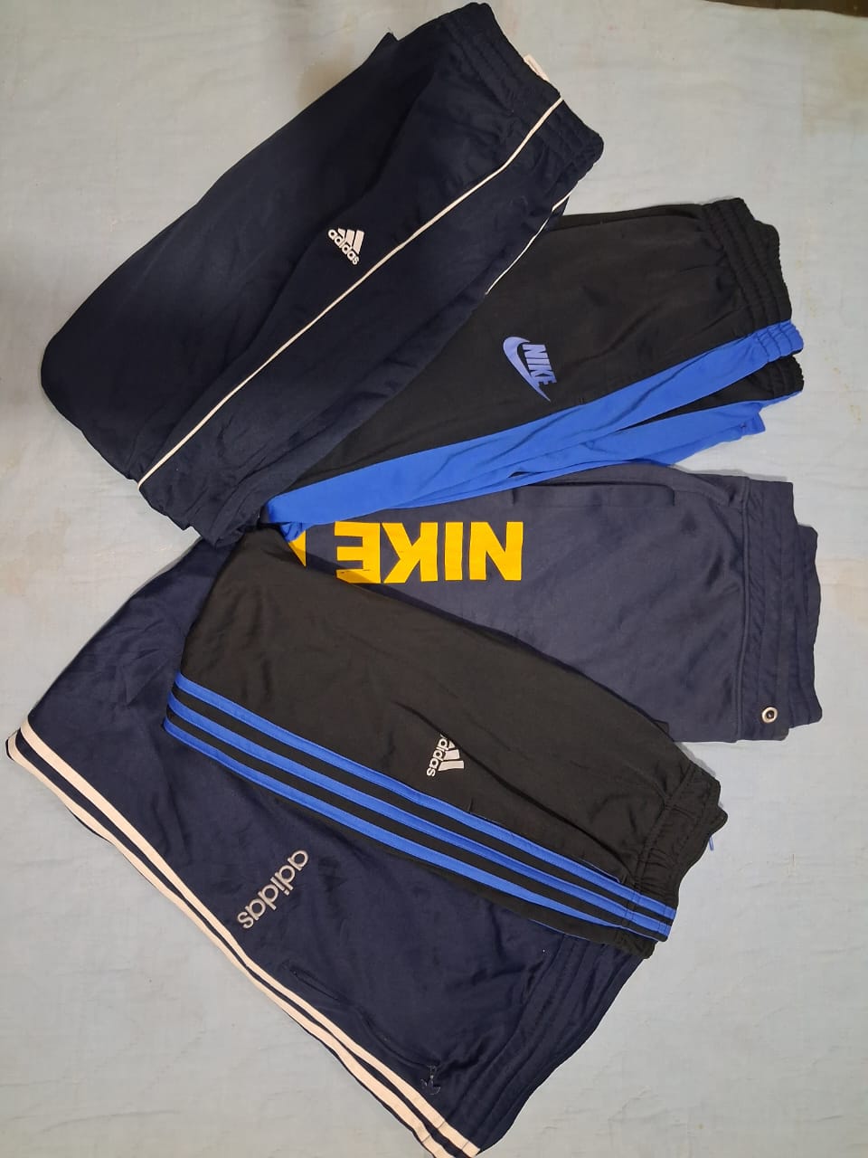 Nike and Adidas track pants