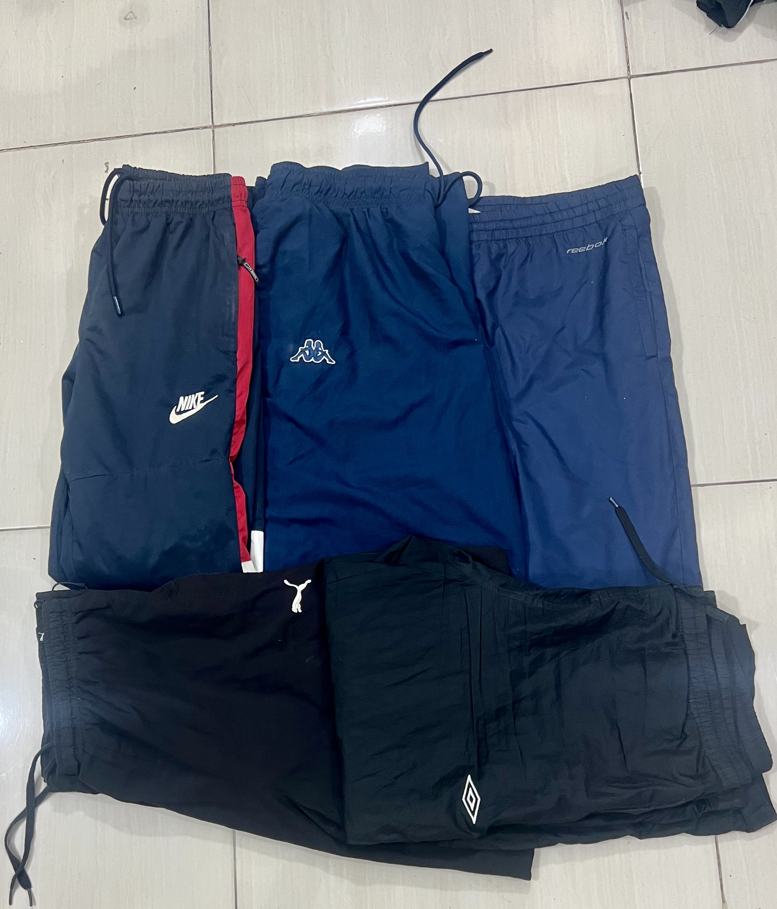 ミックスブランドのトラックパンツ