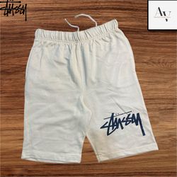 Pantaloni corti in stile rework Stussy color crema..