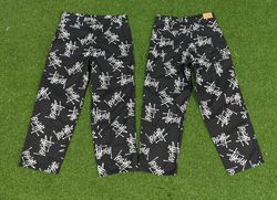 Pantalons de travail imprimés Stussy au style retr..