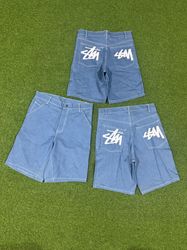 bermuda de denim azul céu stussy estilo retrabalho
