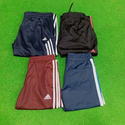 Pantalones y capris Adidas