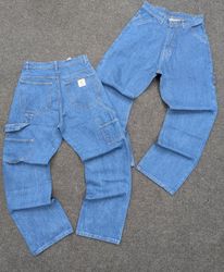Pantalon de travail vintage Carhartt bleu à genoui..