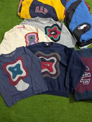 Pull en patchwork de marques mélangées Upcycle