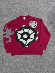 Pull en patchwork Nike upcyclé