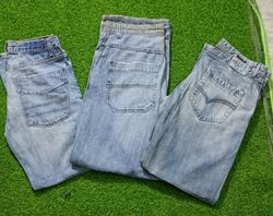 DIESEL ET AUTRES MARQUES D'HOMMES PORTENT DES JEAN..