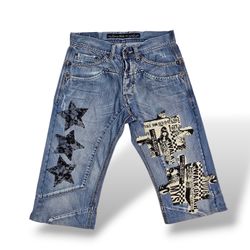 UPCYCLED JORTS WITH PUZZLE PATCH
