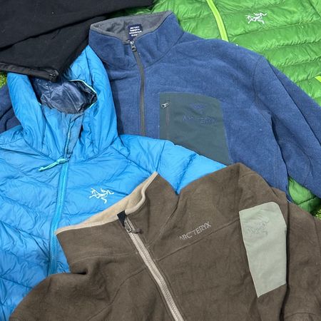 Branded Arcteryx fleece and puffer jackets