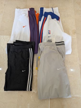 Pantalons de course Nike 100