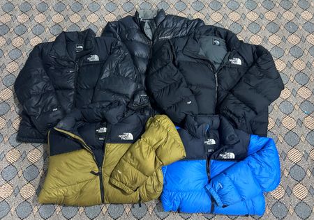 the north face and montbell puffer jacket